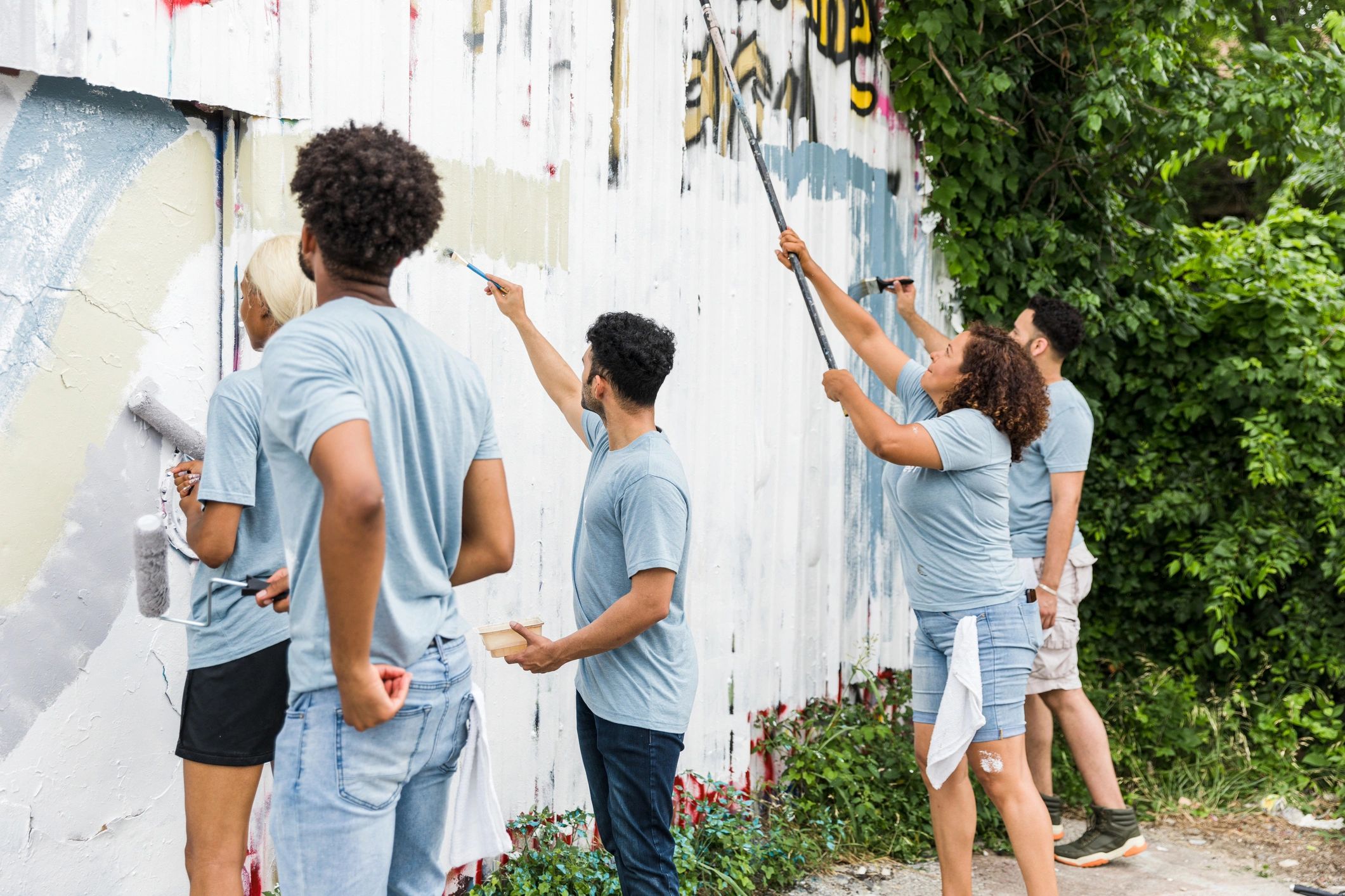 Volunteers painting at a community center