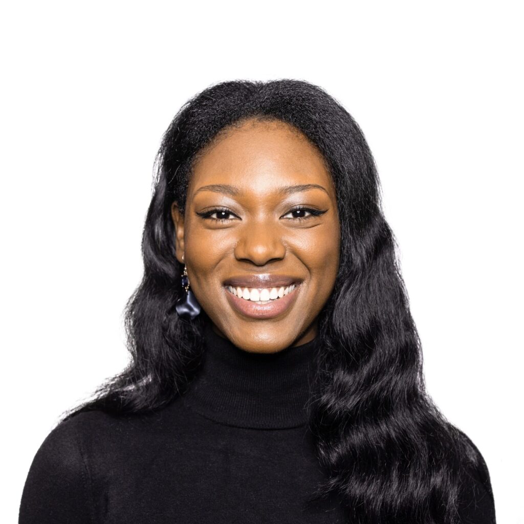 Smiling african woman photographed in a photo studio