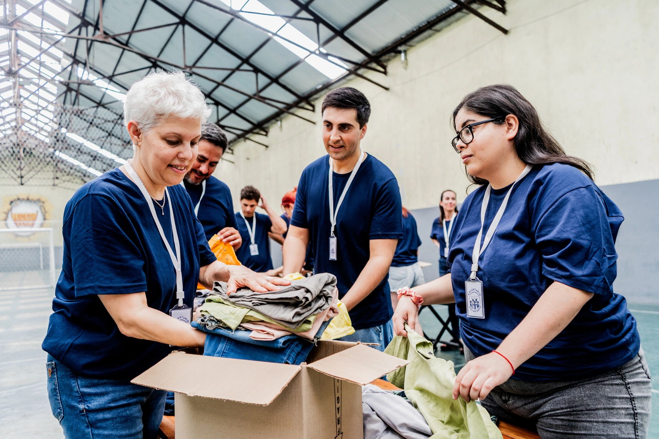Volunteers organizing donation boxes at a community center