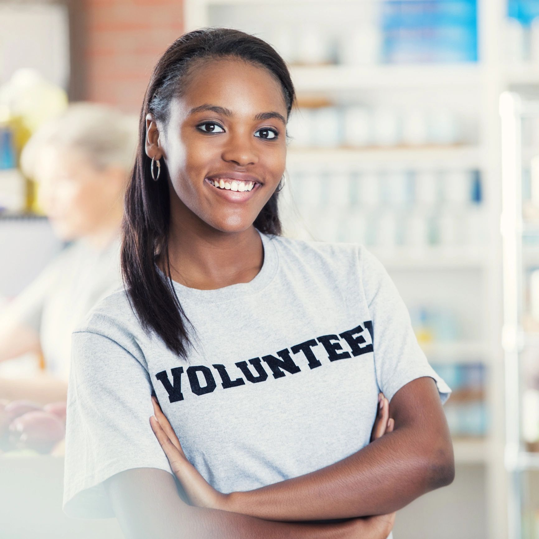 Volunteer standing confidently at a community food bank